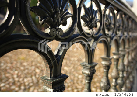 forged lattice fence in the city 17544252