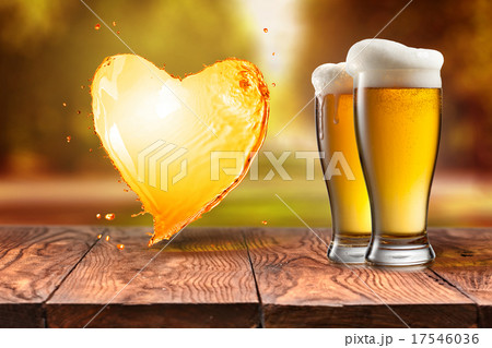 Love beer. Beer in glass with heart splash on wood 17546036
