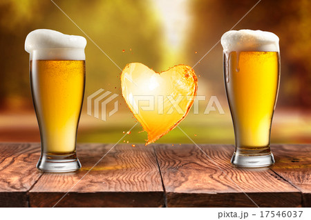 Love beer. Beer in glass with heart splash on wood 17546037