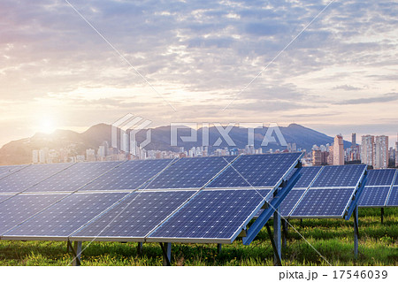 Solar panels with city on background 17546039
