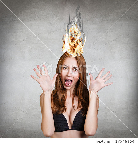 Woman having her brain on fire because of stress Woman having her brain on fire because of stress 17546354