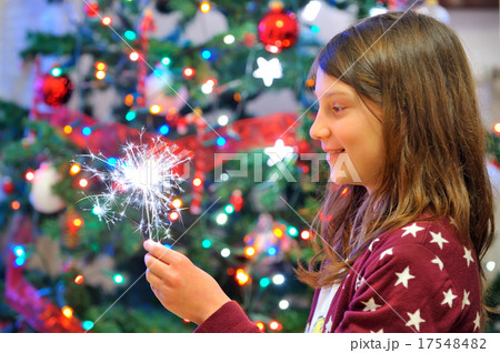 Portrait of cute girl looking at fire sparks. Portrait of cute girl looking at fire sparks. 17548482