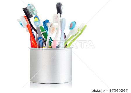 Group of old and used toothbrush in metal cup Group of old and used toothbrush in metal cup 17549047