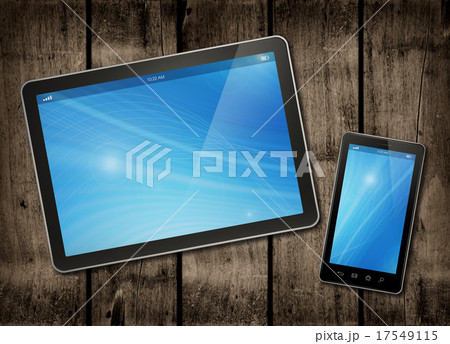 Smartphone and digital tablet PC on a wood table 17549115