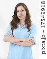 Studio Portrait Of Female Staff Member Wearing Uniform Against W 17549918