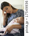 Portrait Of Tired Mother Suffering From Post Natal Depression 17549936