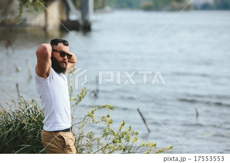 American Bearded Man touching his beard 17553553