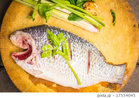Place the fish on a cutting board 17554045