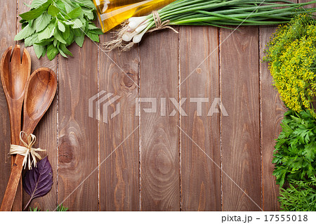 Fresh garden herbs on wooden table 17555018