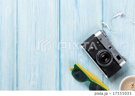 Travel and vacation items on wooden table Travel and vacation items on wooden table 17555035