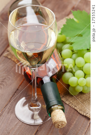 White wine glass, bottle and grapes 17555241