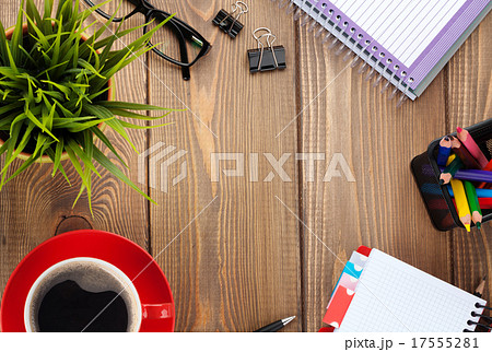 Office table with flower, blank notepad and coffee 17555281