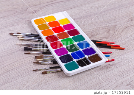 Watercolor paints with brushes on wood Watercolor paints with brushes on wood 17555911