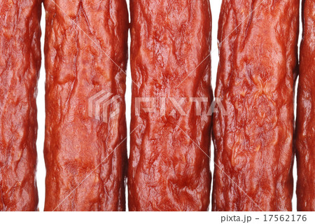 Background of tasty sausages on white 17562176