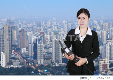business woman holding folder documents with city 17567446