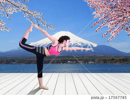 woman doing yoga exercise on wood floor with Mt Fuji background 17567785