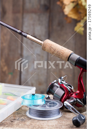 fishing tackles on old wooden board fishing tackles on old wooden board 17569249