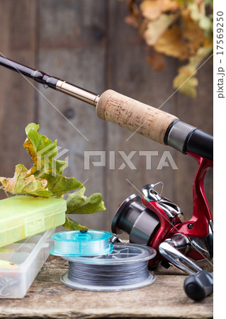 fishing tackles on old wooden board 17569250