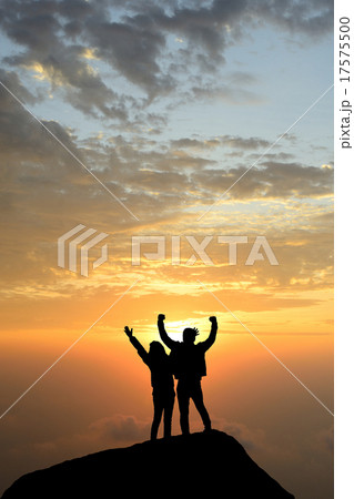 silhouette achievements successful arm up couple is on peak of h 17575500