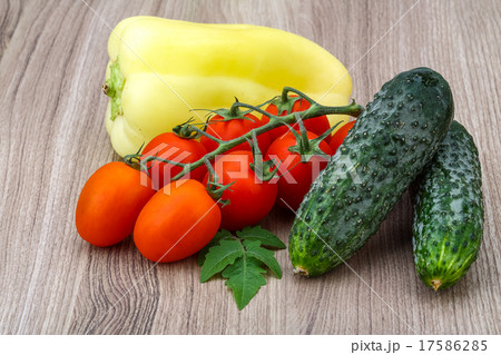 Cucumbers and tomatoes on the branch with yellow pepper Cucumbers and tomatoes on the branch with yellow pepper 17586285