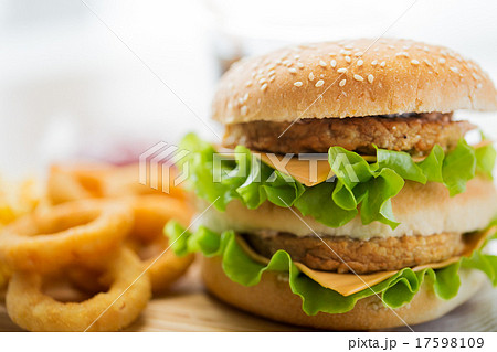 close up of hamburger or cheeseburger on table 17598109