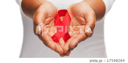 hands holding red AIDS awareness ribbon hands holding red AIDS awareness ribbon 17598264