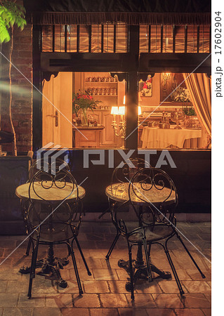 Night view of cozy restaurant in Bruges, Belgium 17602904