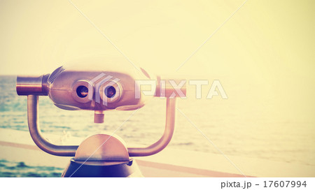 Vintage photo of a binocular pointed at horizon. Vintage photo of a binocular pointed at horizon. 17607994