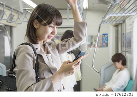 電車通勤する女性の写真素材