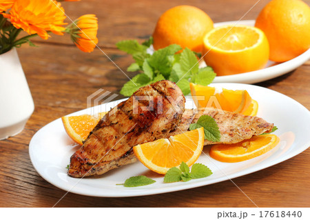 Grilled chicken breast with orange and mint 17618440