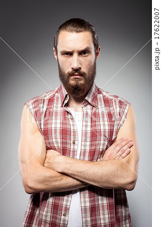 Attractive young man with beard is serious 17622007