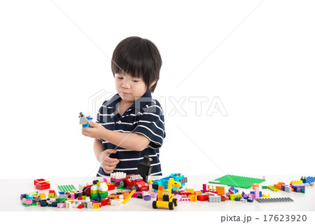 Little asian child playing with colorful construction blocks 17623920