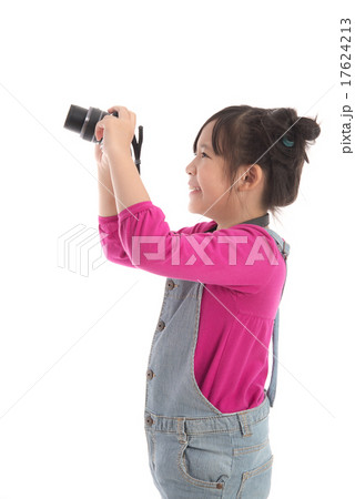 Cute asian girl holding camera on white backgroun Cute asian girl holding camera on white backgroun 17624213