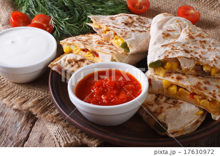 Quesadilla sliced with vegetables, chicken closeup 17630972
