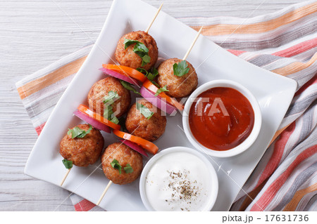 meatballs on skewers with vegetables top view meatballs on skewers with vegetables top view 17631736