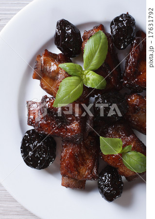Pork ribs stewed with prunes closeup top view Pork ribs stewed with prunes closeup top view 17631792