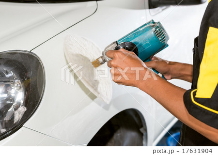 Car polishing series : Worker waxing white car 17631904