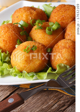 potato croquettes and vegetables close-up 17632169