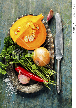 Pumpkin soup ingredients on wooden background 17633477