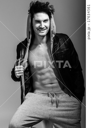 Athletic man wearing hoodie jacket. Studio shot Athletic man wearing hoodie jacket. Studio shot 17634561