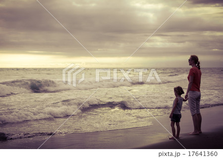 Mother and son playing on the beach at the day time. Mother and son playing on the beach at the day time. 17641360