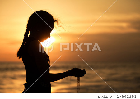 Portrait of sad teenager girl standing on the beach Portrait of sad teenager girl standing on the beach 17641361