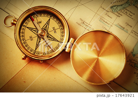 Antique brass compass over old map Antique brass compass over old map 17643921