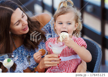 Happy mom and daughter eating ice cream 17645125