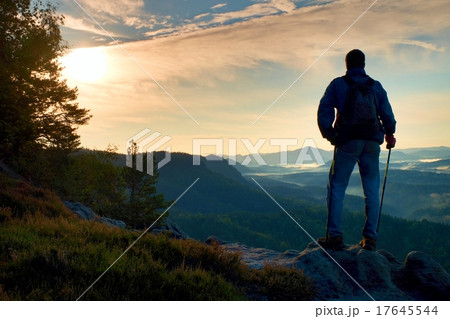 Silhouette of man with backpack. Sunny day in rock 17645544