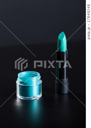 Lipstick and eye shadow in bright teal green color 17649248