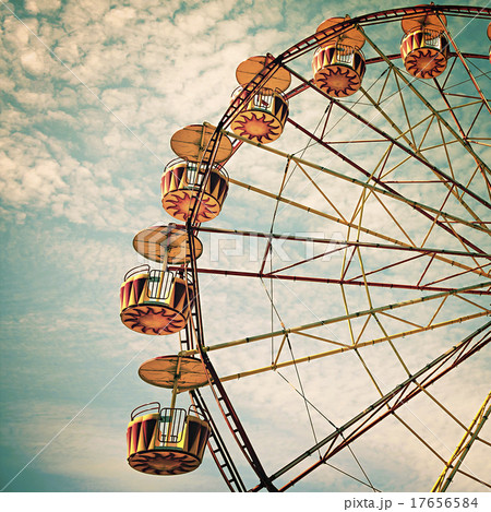 yellow ferris wheel against a blue sky yellow ferris wheel against a blue sky 17656584