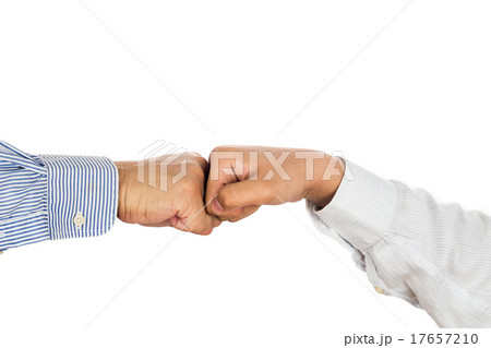 Fist bump on formal wear, gesturing an agreement Fist bump on formal wear, gesturing an agreement 17657210