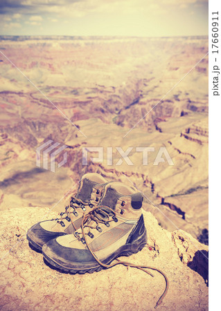 Vintage toned old trekking shoes in Grand Canyon.. 17660911