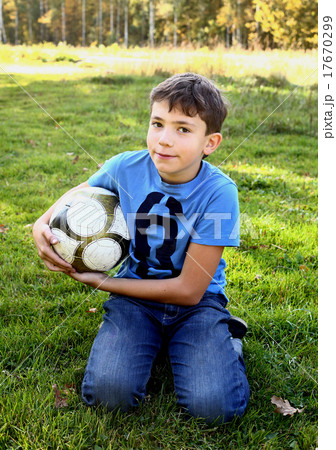 boy with soccer ball on green grass background 17670299